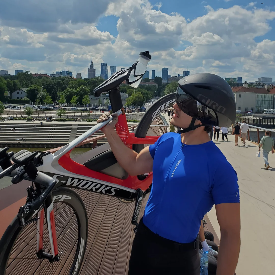 Toufic holding the triathlon bike in Warsaw